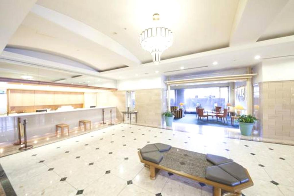Postel nebo postele na pokoji v ubytování Art Hotel Joetsu