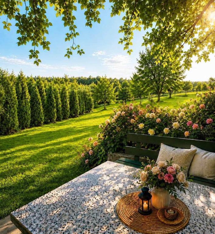 a park bench with a table and flowers on it at Sarajevo Flower Garden - Entire House & Private Garden in Vogošća
