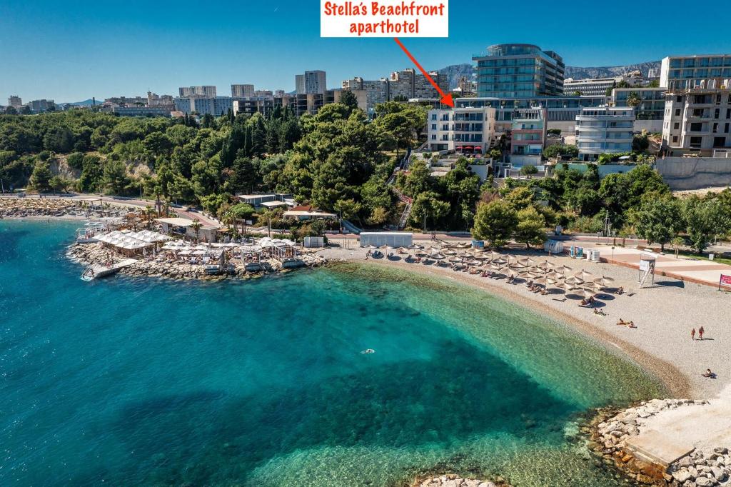 an aerial view of a beach in a resort at STELLA'S BEACHFRONT - Aparthotel - FREE PARKING in Split