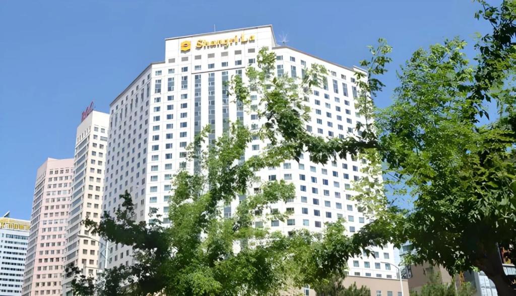a large white building with a samsung sign on it at Shangri-La Changchun in Changchun