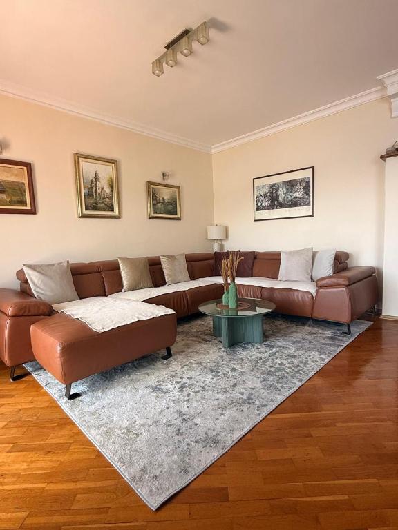 a living room with a couch and a table at Lovely duplex apartment in Savina