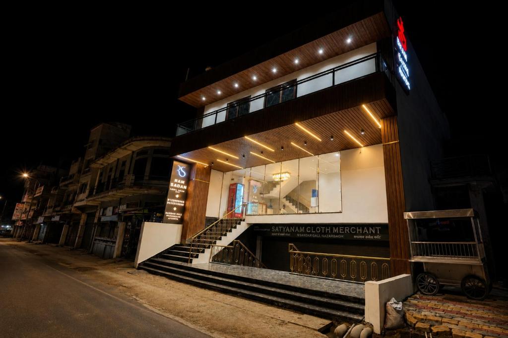 a building with lights on the side of a street at Hotel Ram Sadan in Ayodhya