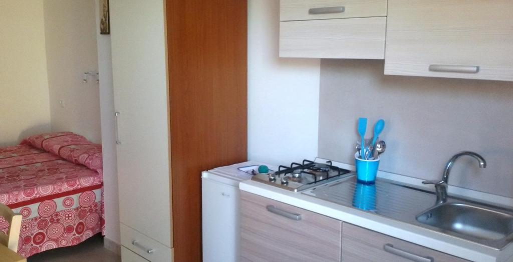 a kitchen counter with a sink and a sink at Green Garden Eco-Holiday in Vieste
