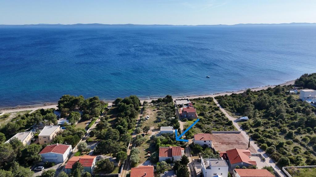 an aerial view of a beach with houses and the ocean at Villa Mediteran - Beach Villa with Jacuzzi in Vir