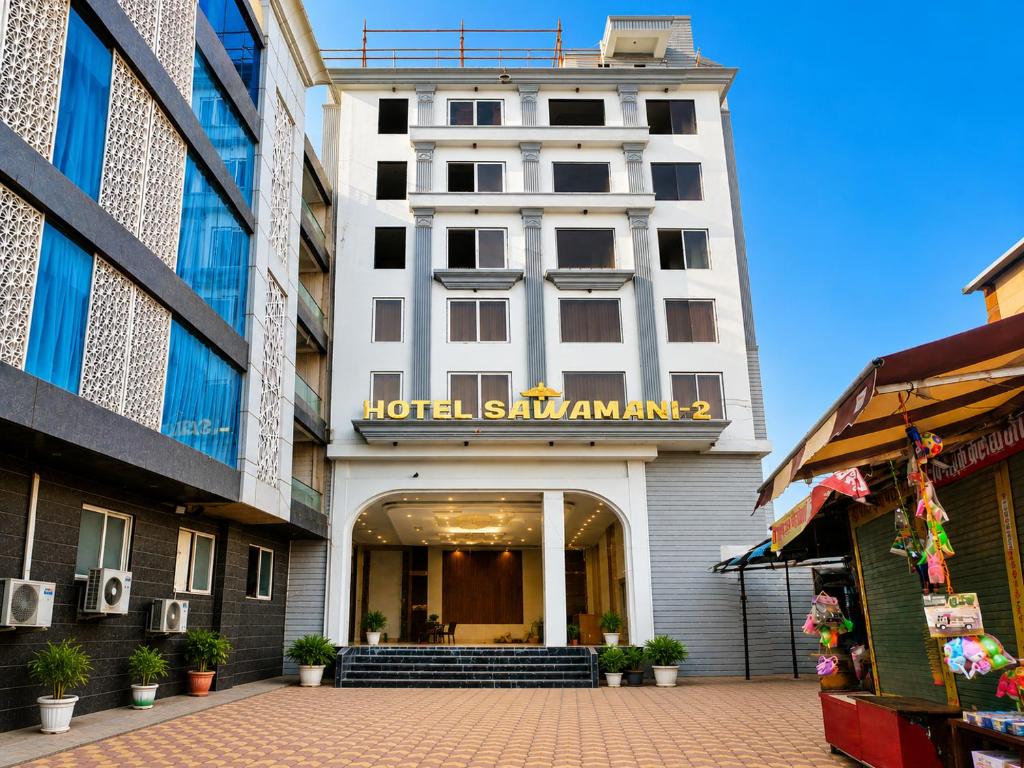 a hotel with a sign on the front of a building at Hotel Sawamani - 100 Meters from Khatushyam ji in Khātu