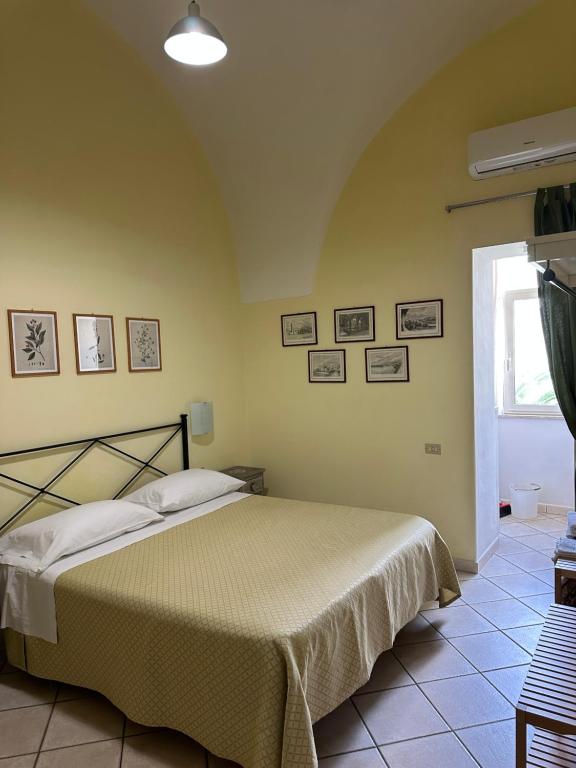 a bedroom with a bed in a room at Anfiteatro apartment in Formia