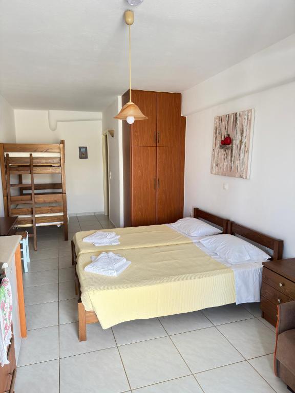 a bedroom with a bed in a room at Calm Paros in Logaras