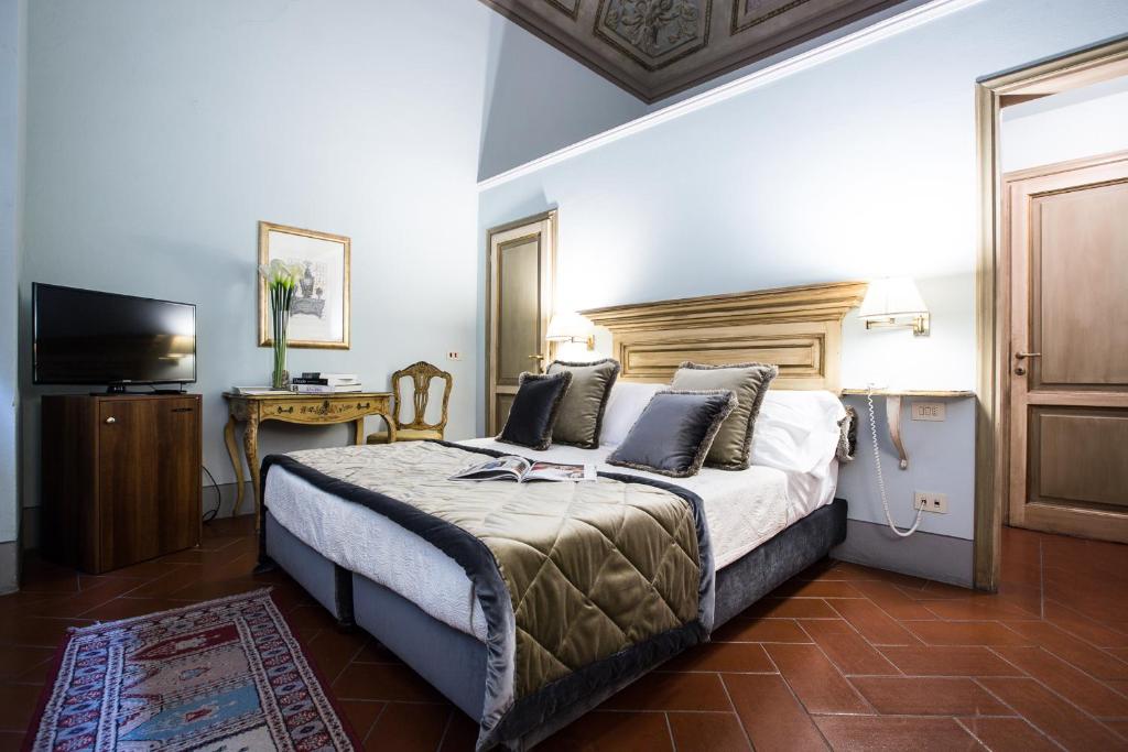 Posteľ alebo postele v izbe v ubytovaní Hotel Burchianti