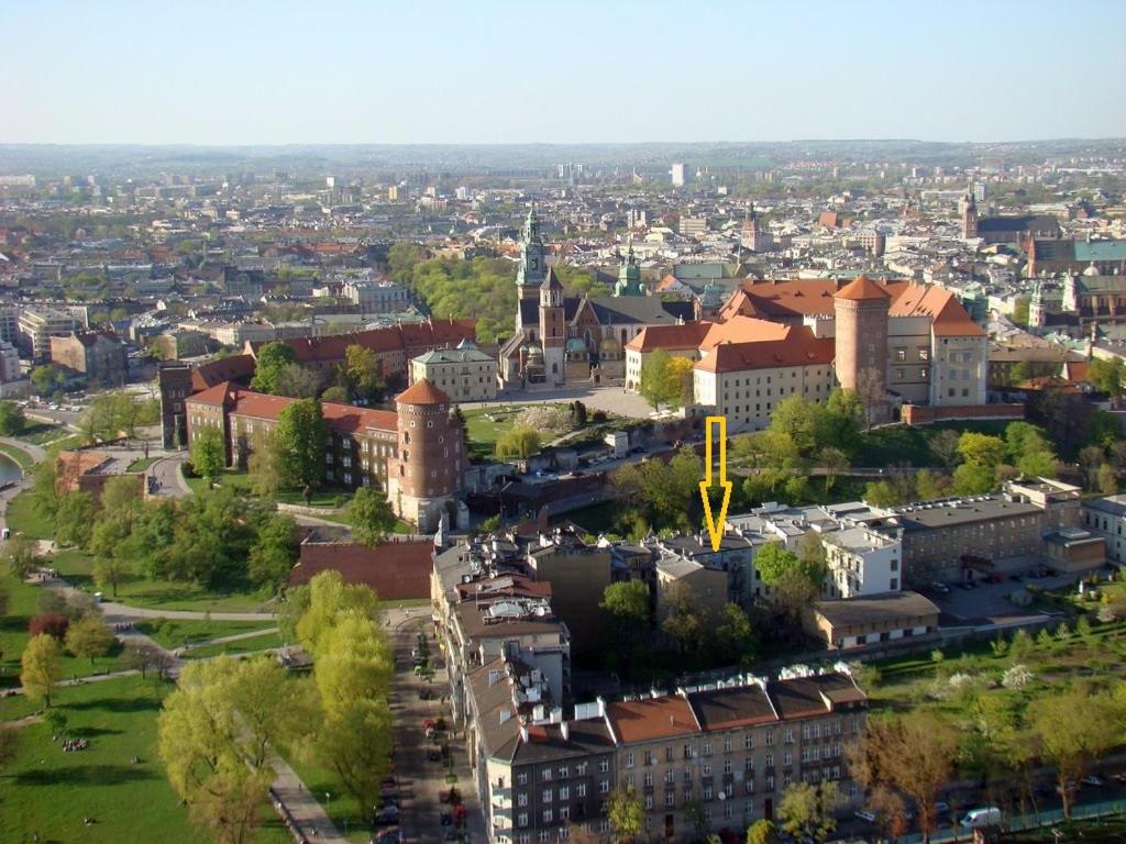 an overhead view of a city with buildings and trees at Apartment Bernardynska in Krakow