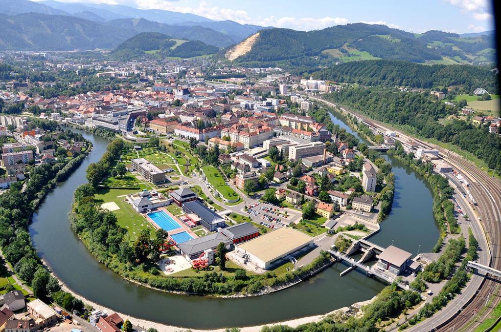an aerial view of a city next to a river at Caroline in Leoben