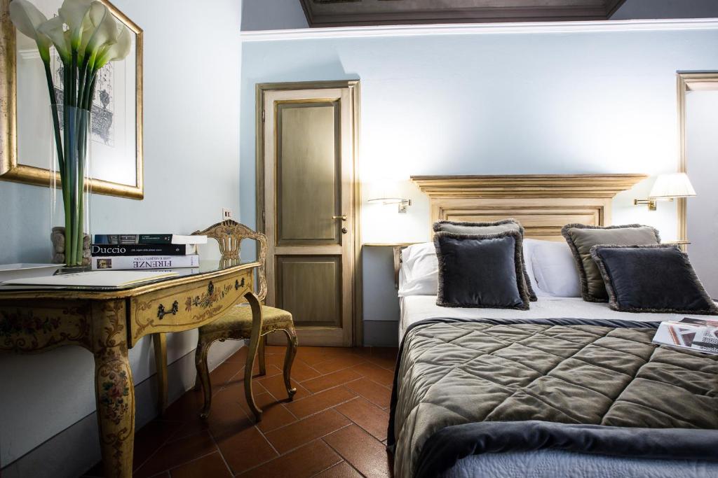 Posteľ alebo postele v izbe v ubytovaní Hotel Burchianti