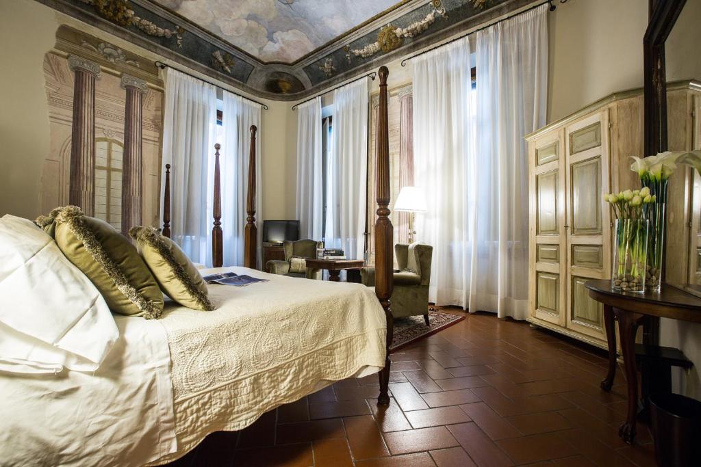 Posteľ alebo postele v izbe v ubytovaní Hotel Burchianti