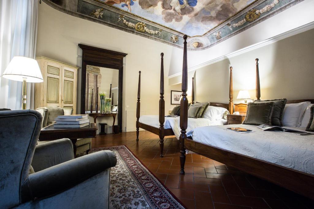 Posteľ alebo postele v izbe v ubytovaní Hotel Burchianti