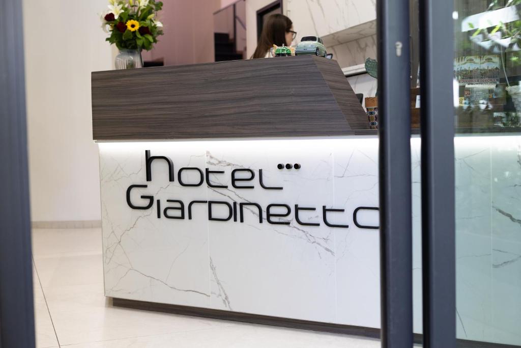 a sign for a hotel gardener at Hotel Giardinetto Al Sant'Orsola in Bologna