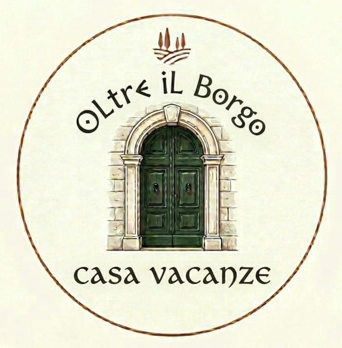 a door with the words olives ii brothers csa vazquez at Oltre il Borgo in Valentano
