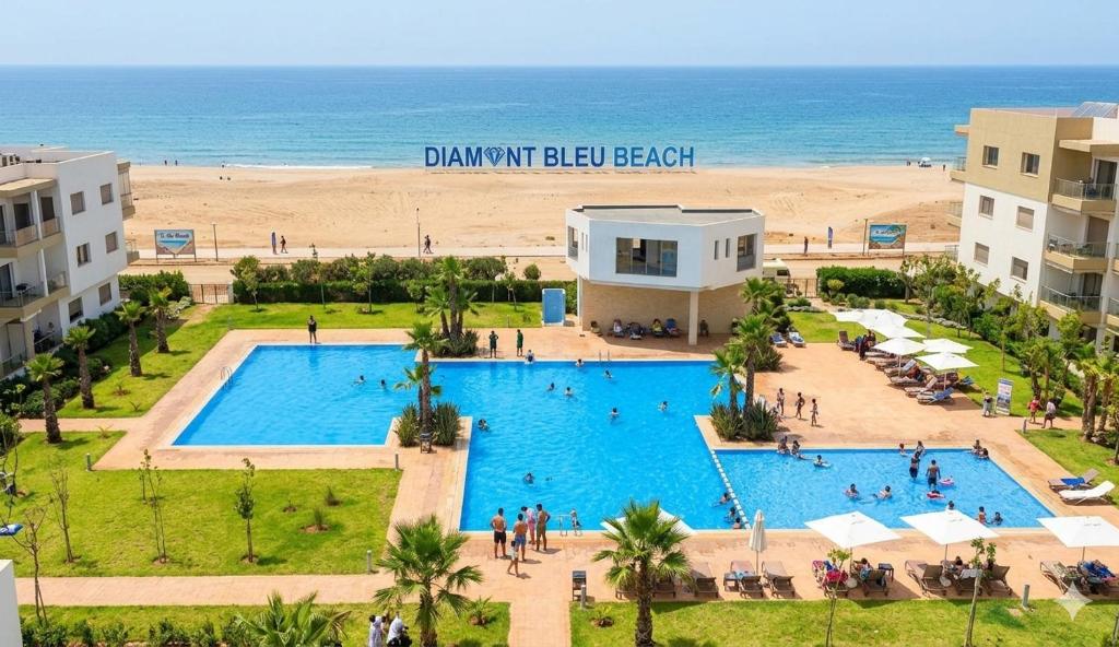 an aerial view of a pool and the beach at Diamond Blue in Sidi Rahal