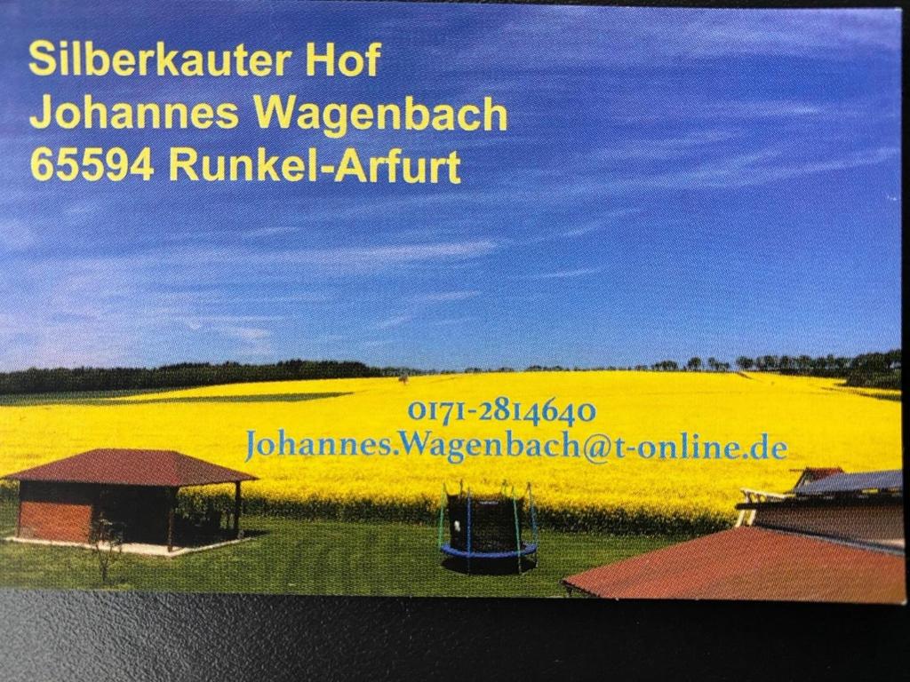 a poster of a rapeseed field with a picture of a field at Monteurwohnung in Runkel