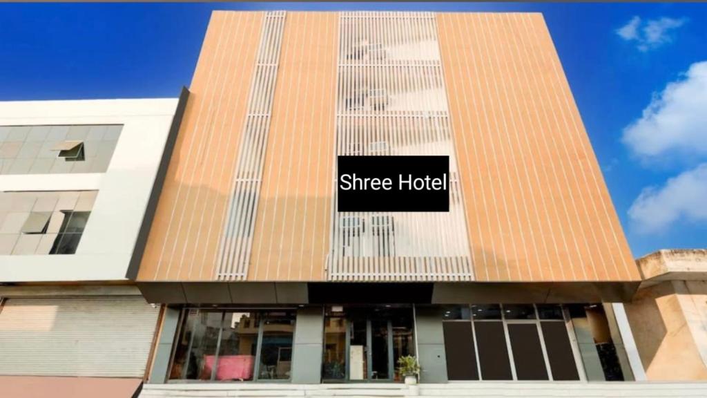 a building with a sign that reads since hotel at Shree Hotel in Rewāri