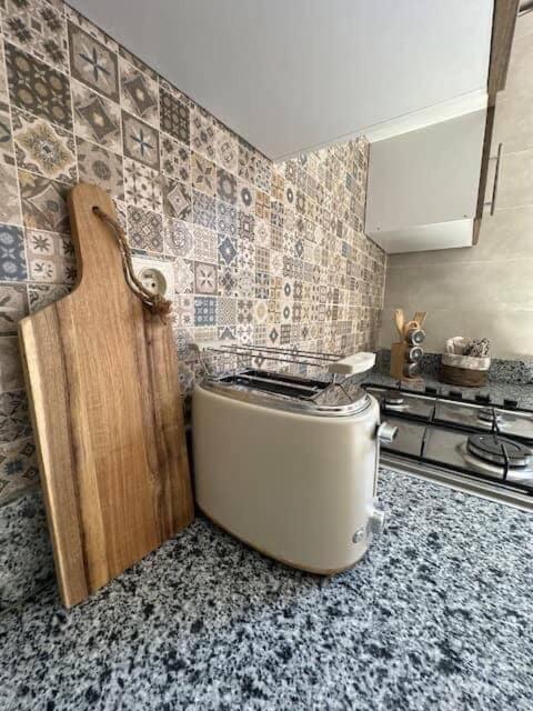 a kitchen with a toilet in the corner of a kitchen at Le Balcon Bohème des Golfs in Marrakesh