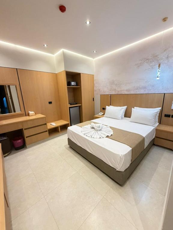 a bedroom with a large bed in a room at Royal Hotel in Cairo