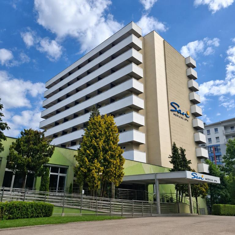 a building with a sap sign in front of it at San Medical Spa in Kołobrzeg