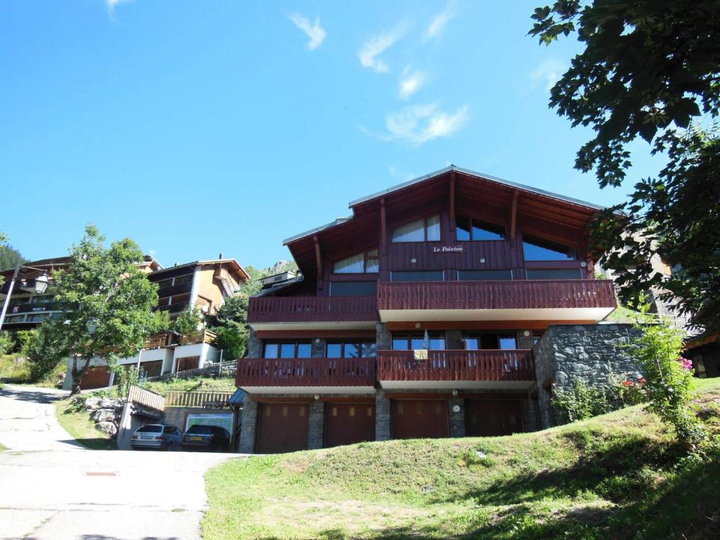a large building with a lot of windows at Résidence Le Pointon - 3 Pièces pour 6 Personnes MAE-3314 in Champagny-en-Vanoise