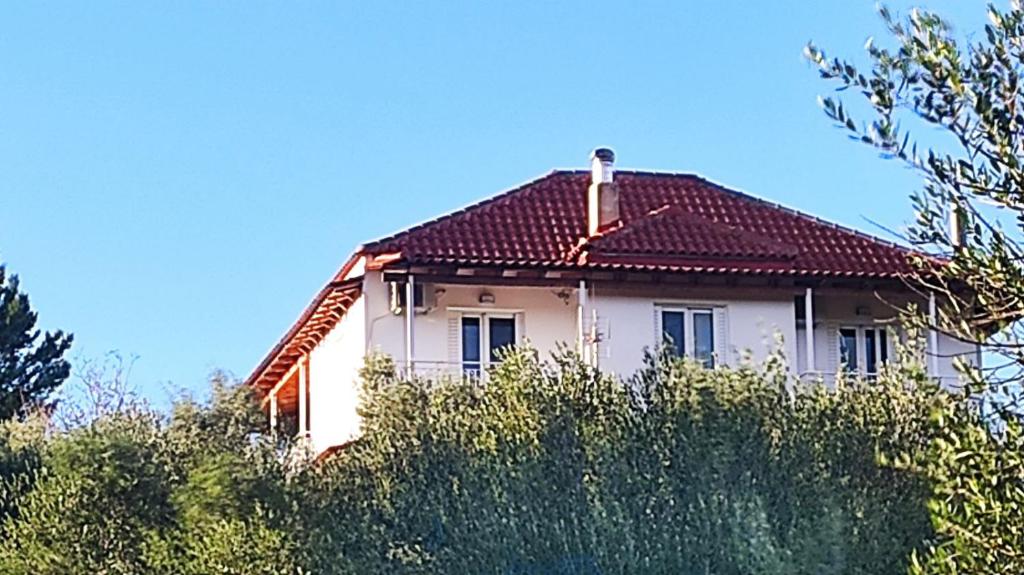 a white house with a red roof at Villa Fotini III in Amalias