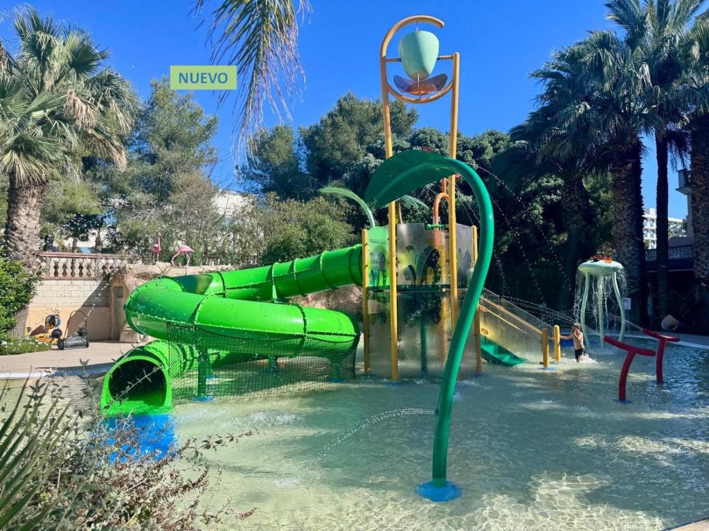 a water park with a slide in the water at Palas Pineda in La Pineda