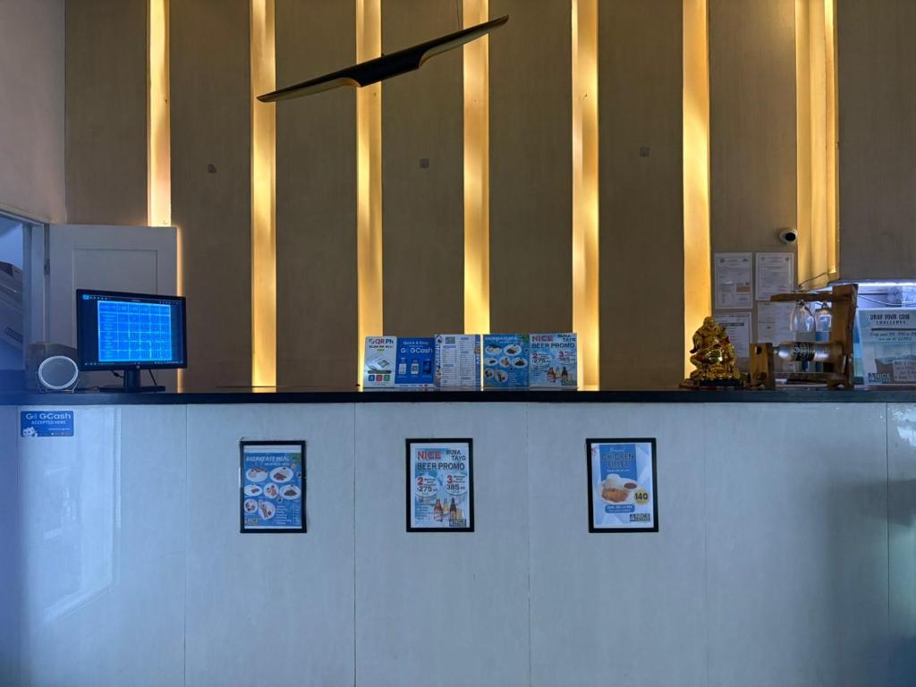 a counter with a computer on top of it at Nice Hotel Mac Arthur in Manila