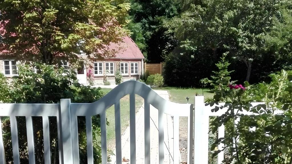 a white picket fence in front of a house at Birkenhof in Achtrup