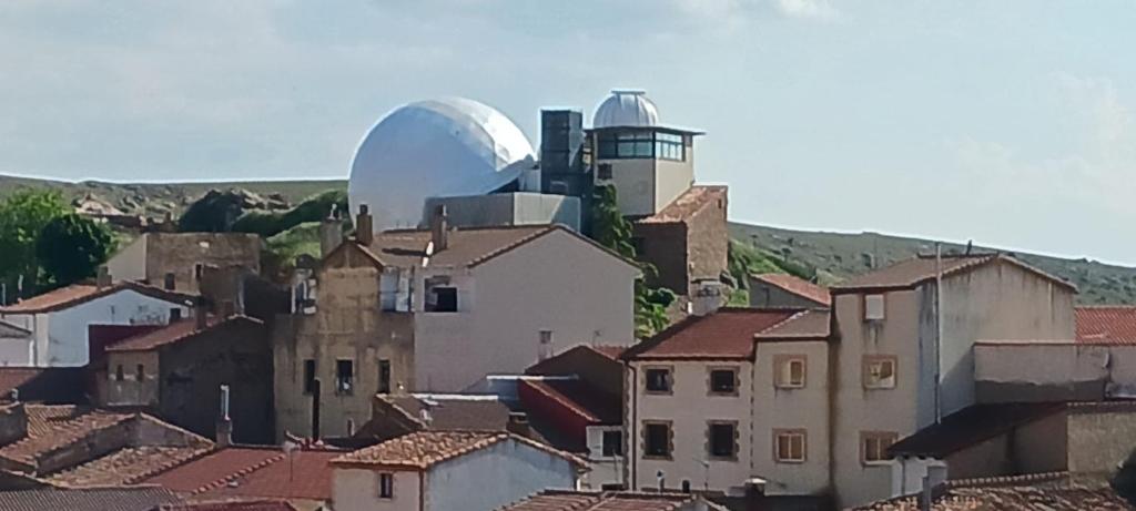 a view of a city with aysical object in the background at Luna de Borobia in Borobia