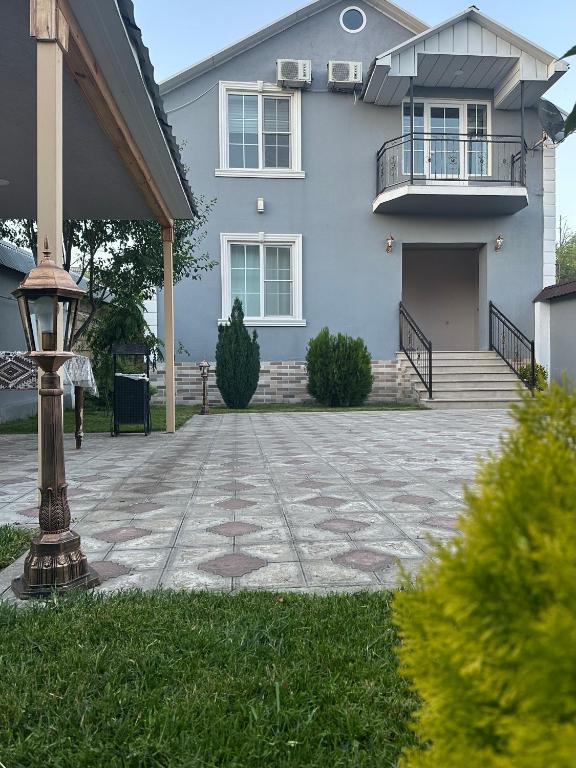 a house with a stone driveway in front of it at Gabala Central Villa in Gabala