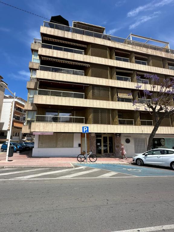 a bike parked in front of a building at piso en puerto de Jávea in Jávea