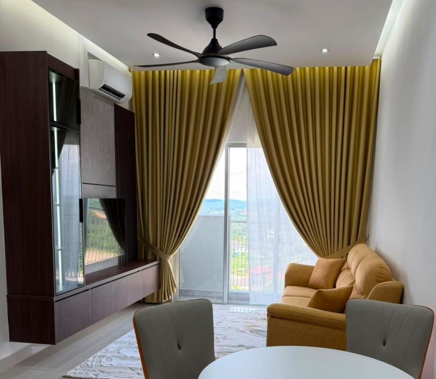 a living room with a couch and a ceiling fan at Sufi Islamic Homestay for Islamic only in Nilai