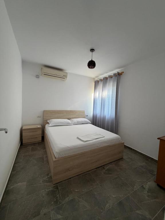 a bedroom with a bed in a room at Guest House Central Vlora in Vlorë