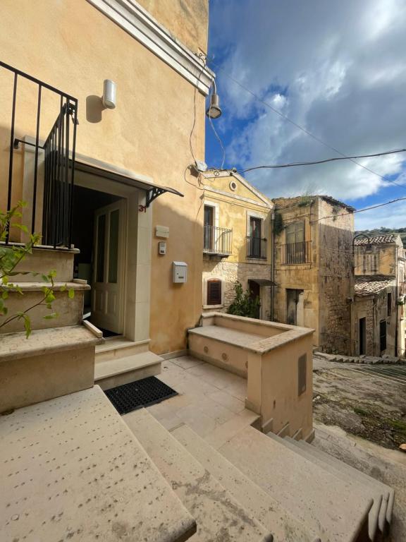 an empty courtyard of a building in a city at CasaCastellett in Modica