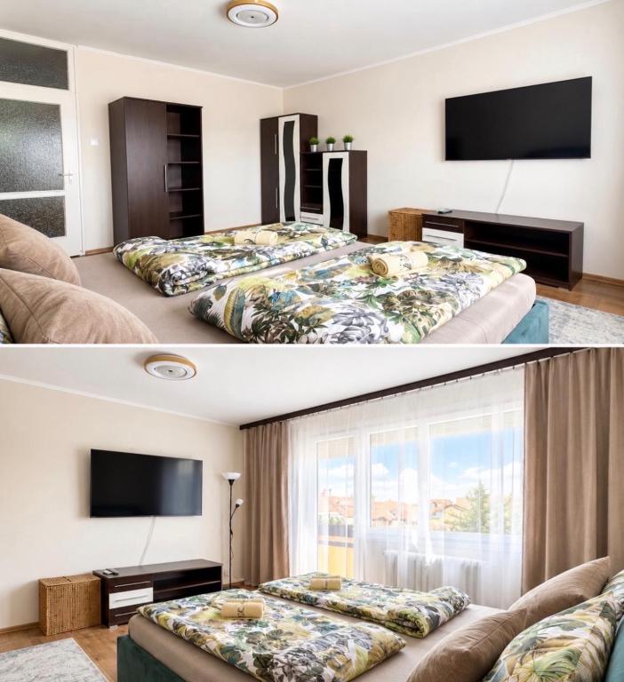 a bedroom with a large bed and a tv at Tófenék Deluxe Apartman in Szolnok