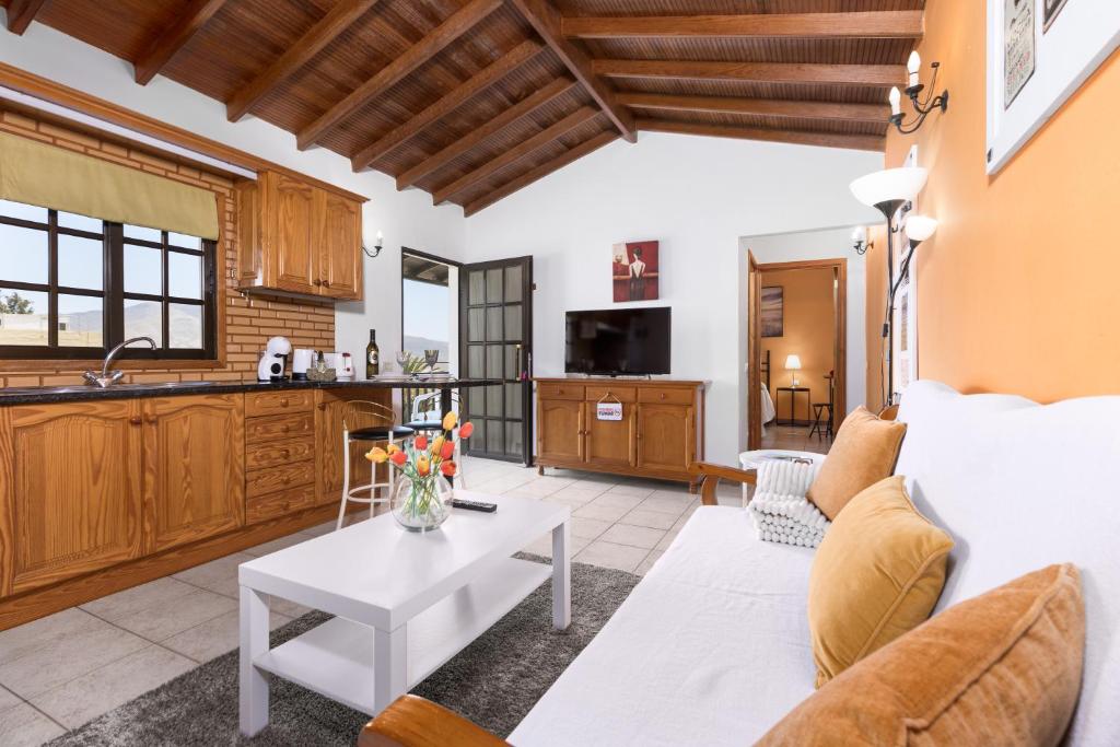 a living room with a couch and a table at Home2Book Las Tinajas A, Peaceful Retreat in Triquivijate