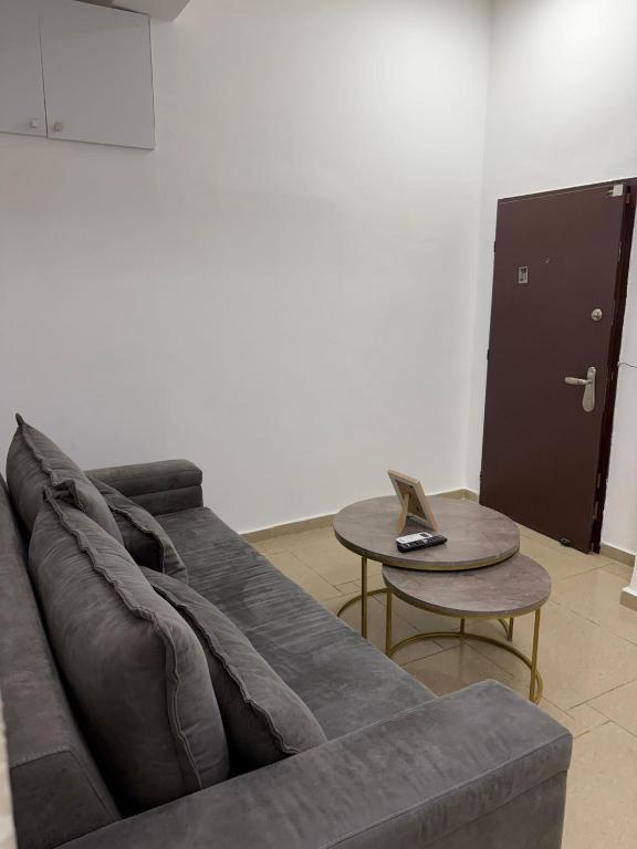 a living room with a couch and a table at Laila's studio in Haifa