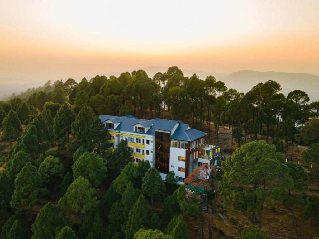an aerial view of a building in the trees at The Hosteller Lansdowne in Lansdowne