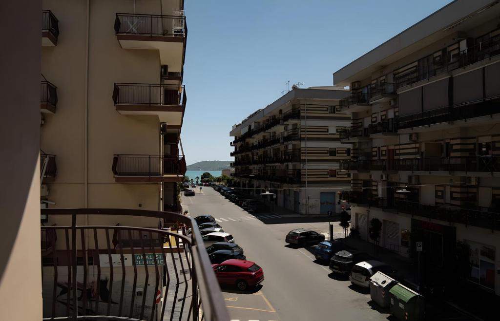a view from a balcony of a street with parked cars at Casa vacanza Via Roma 103 in Crotone