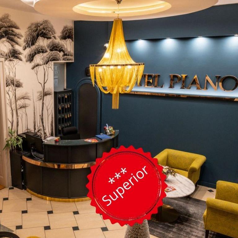a lobby with a red sign in front of a pharmacy at Hotel Piano in Szeged