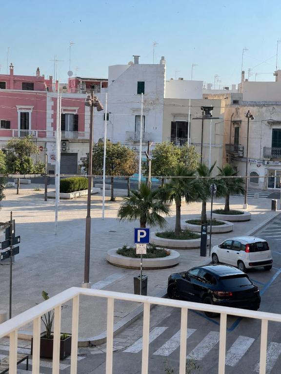 a parking lot with a car parked in a parking lot at Casa Mare con finestra su balcone in Polignano a Mare