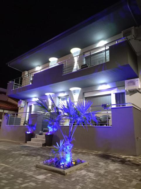 a house with blue lights in front of it at Celestia Irene Suites 2 in Vromerí