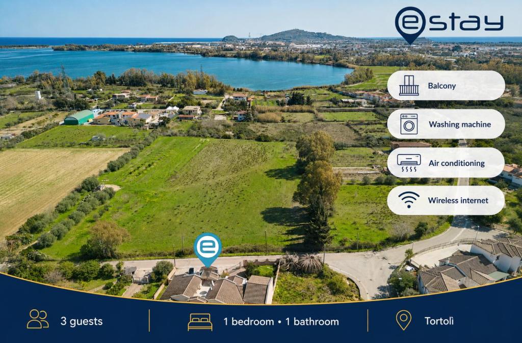an aerial view of a park with a lake at Estay - Sun & Sea Studio in Tortolì