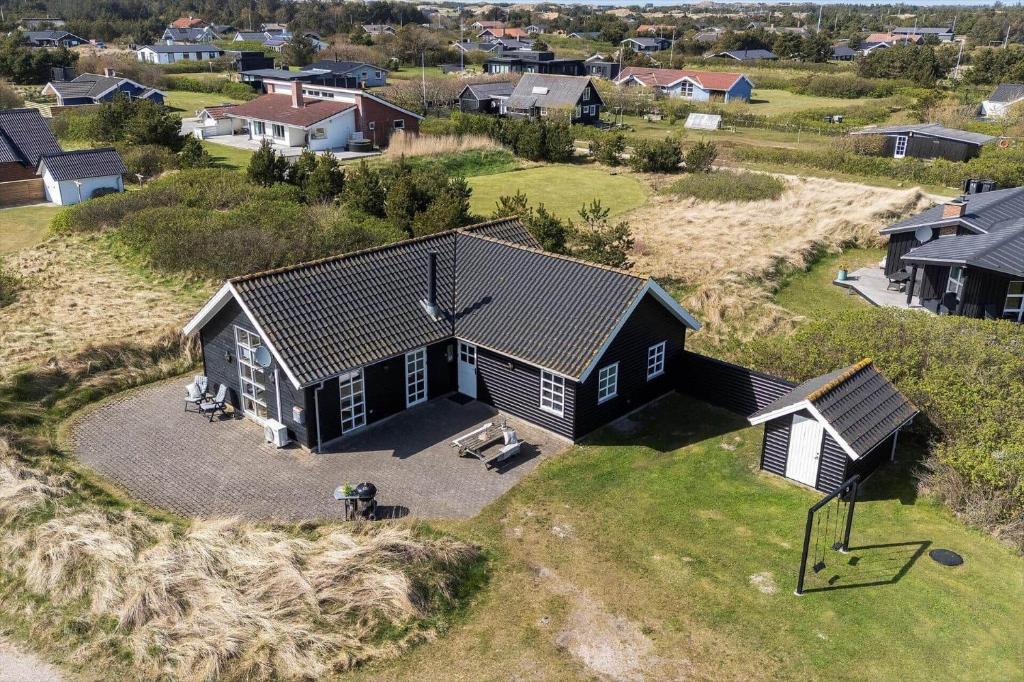 an aerial view of a house in a residential neighborhood at 2219-Ringkobing-Frans-Julius-Vej-2 in Søndervig