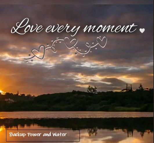 a sunset with the words love every momentophone player and water at Golf Beach and Sea in Southbroom