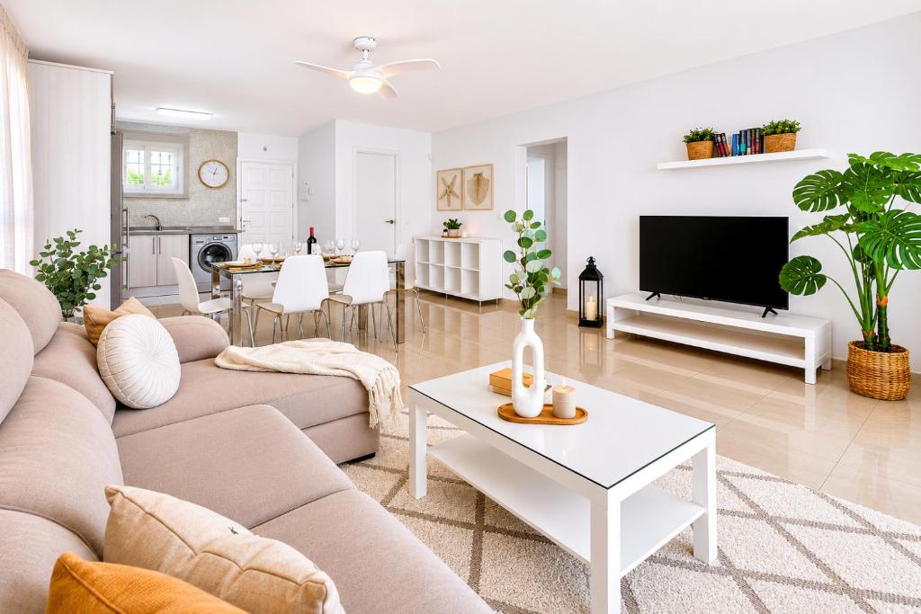 a living room with a couch and a table at DUPLEX C9 con PISCINA PRIVADA in Callao Salvaje
