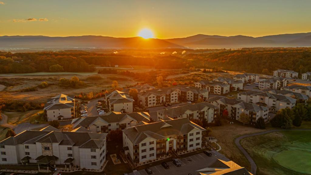 an aerial view of a residential neighborhood at sunset at Massanutten Resort in Massanutten