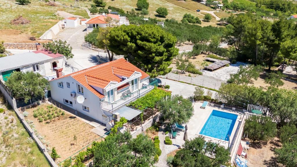 an aerial view of a house with a swimming pool at House Ratac in Bol